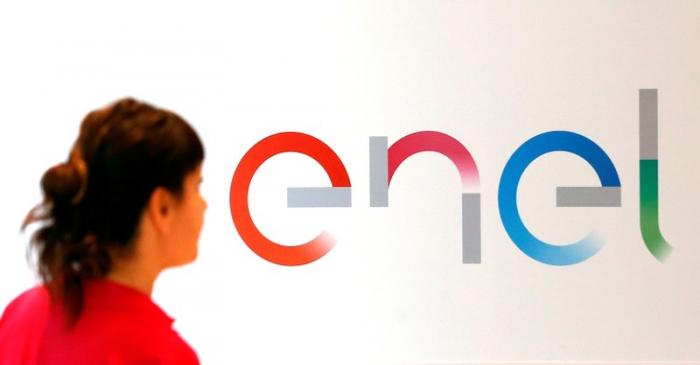 FILE PHOTO: The new logo of Italy's biggest utility Enel is seen inside its flagship store in