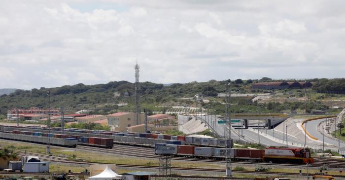 An SGR cargo train transferring containers leaves the port of Mombasa