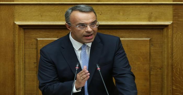 Greek Finance Minister Christos Staikouras speaks during a parliamentary session before a