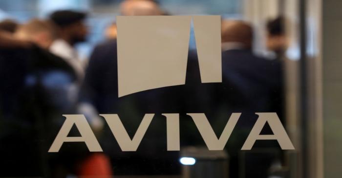 A logo sits on the window of the Aviva head office in the city of London