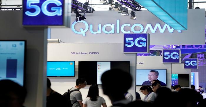 FILE PHOTO: Signs of Qualcomm and 5G are pictured at Mobile World Congress (MWC) in Shanghai