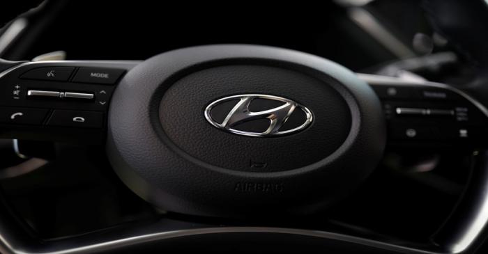 The logo of Hyundai Motors is seen on a steering wheel of a all-new Sonata sedan on display at