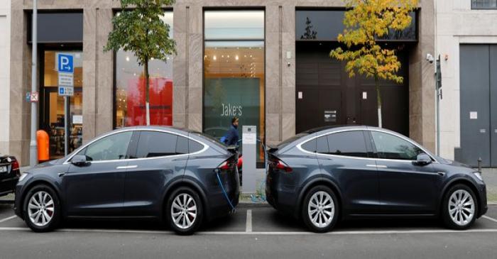 Tesla Model X electric cars recharge their batteries in Berlin