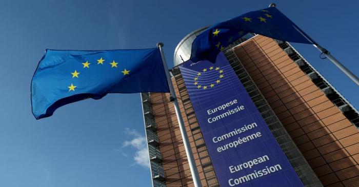 European Union flags flutter outside the European Commission in Brussels