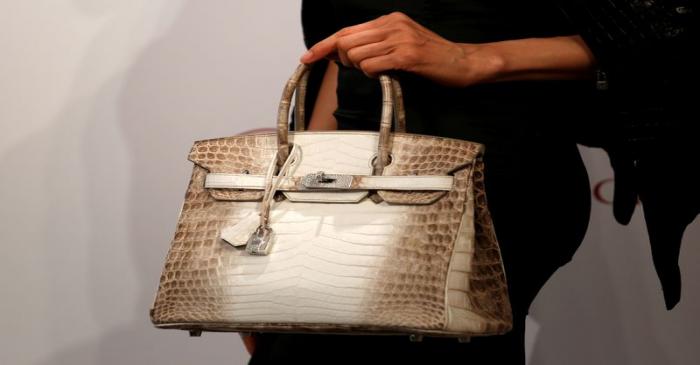 FILE PHOTO: A model carries a Hermes signature Birkin with Himalayan crocodile leather during a