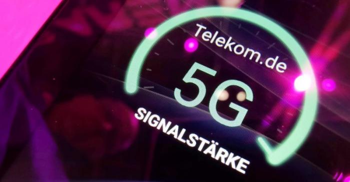 FILE PHOTO: Signal strength of Deutsche Telekom 5G displayed on a mobile device at the IFA