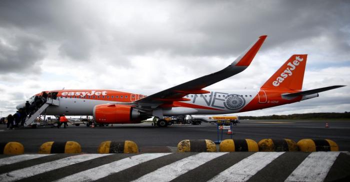 Passengers board an easyJet plane at the Nantes-Atlantique airport in Bouguenais near Nantes
