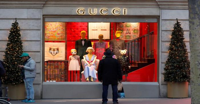 A Gucci sign is seen outside a shop in Paris