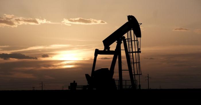 FILE PHOTO: Oil pump jacks work at sunset near Midland, Texas