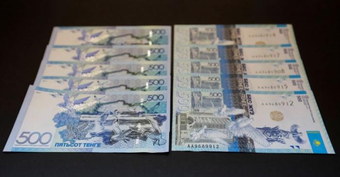 FILE PHOTO: New 500 tenge banknotes are displayed in this picture illustration in Almaty