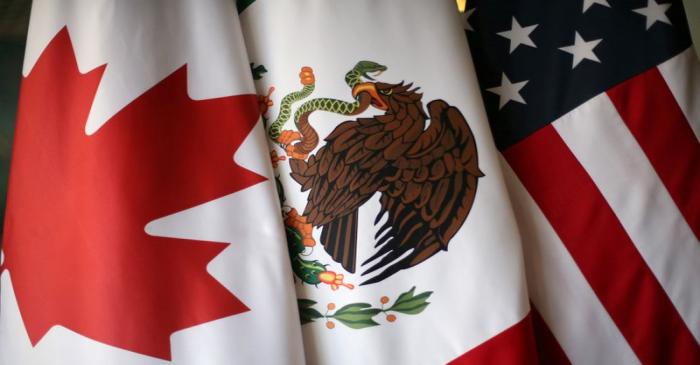 FILE PHOTO: Flags are pictured during the fifth round of NAFTA talks involving the United