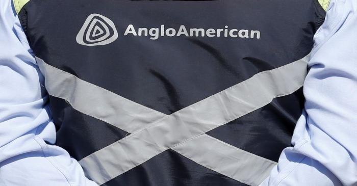 FILE PHOTO: Logo of Anglo American is seen on a jacket of an employee of the Los Bronces copper