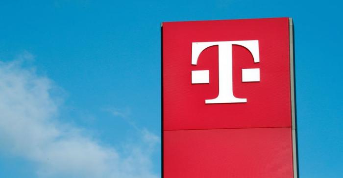 FILE PHOTO: A logo of Germany's telecommunications giant Deutsche Telekom AG is seen before the