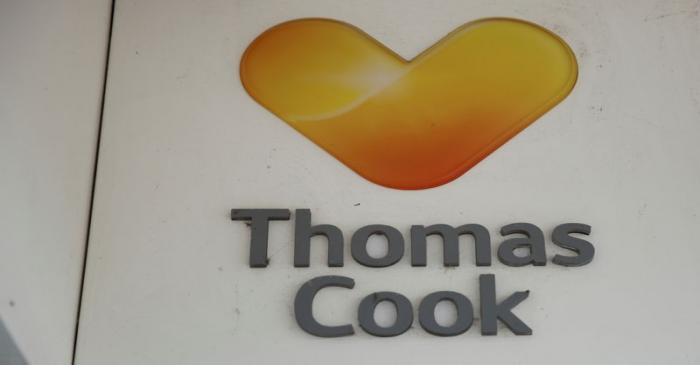 Signage is seen outside a closed Thomas Cook travel agents store near Manchester, Britain