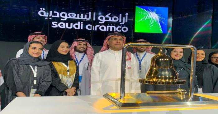 Participants attend the official ceremony marking the debut of Saudi Aramco's IPO on the