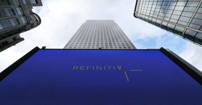 FILE PHOTO: An advertisement for Refinitiv is seen on a screen in London's Canary Wharf