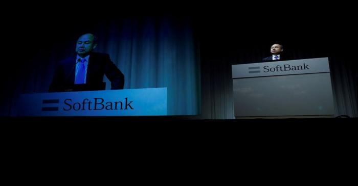 FILE PHOTO: Japan's SoftBank Group Corp Chief Executive Masayoshi Son attends a news conference
