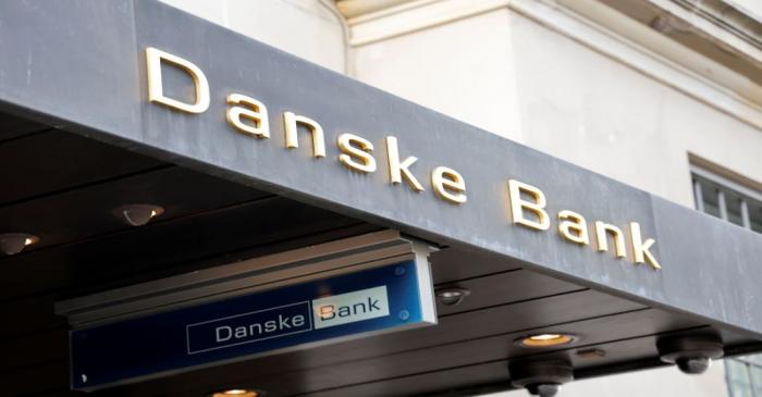 Danske bank signs are seen on a bank's headquarters in Copenhagen
