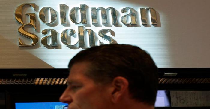 A trader works inside the Goldman Sachs stall on the floor at the New York Stock Exchange