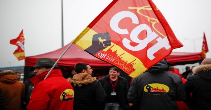 Workers of French oil giant Total gather in front of the oil refinery in Donges