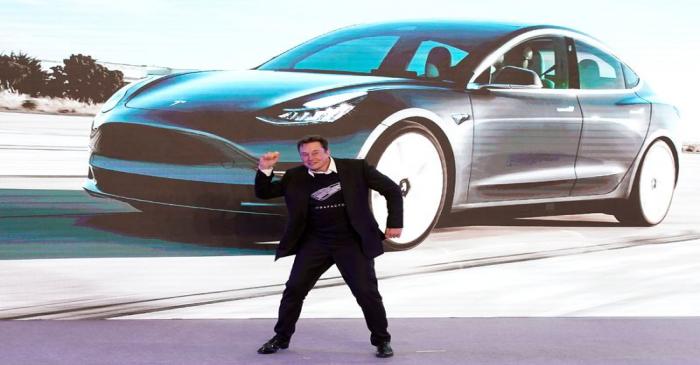 Tesla Inc CEO Elon Musk dances onstage during a delivery event for Tesla China-made Model 3