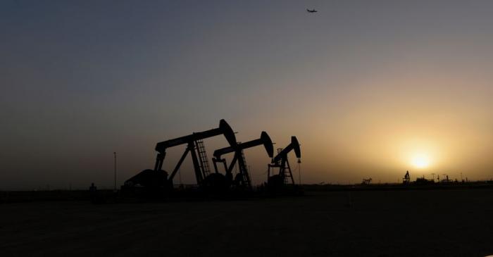 FILE PHOTO: Pump jacks operate at sunset in Midland