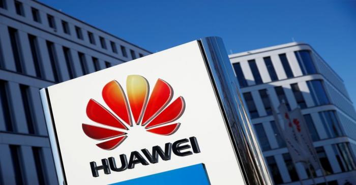 FILE PHOTO: The logo of Huawei Technologies is pictured in front of the German headquarters of