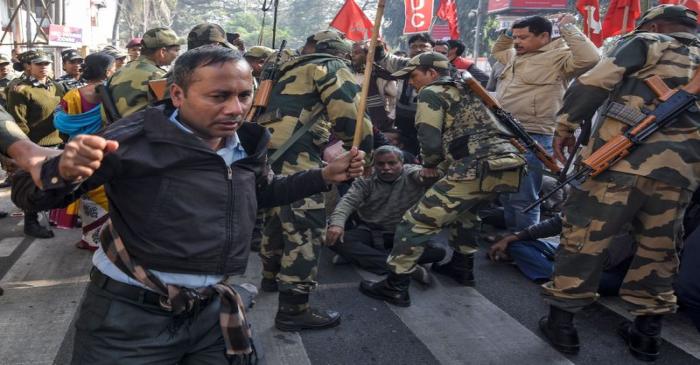 Activists of the Centre of Indian Trade Unions are detained during an anti-government protest