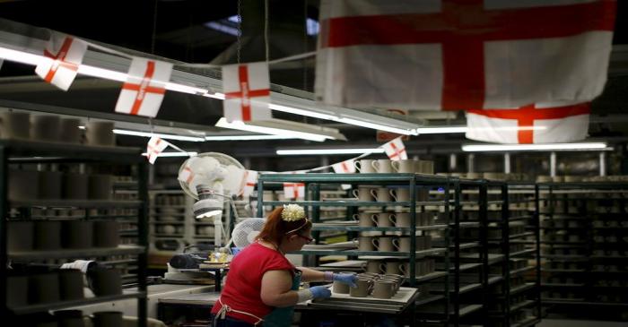 File picture shows a worker putting handles onto cups at the Portmeirion Factory in