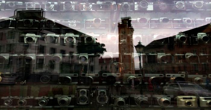 Vintage cameras are on decorative display in the shop window of a photo studio in Altenburg