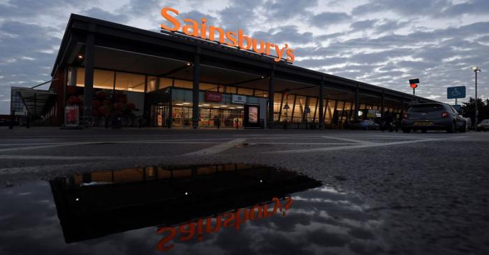 Signage for Sainsbury's is seen at a branch of the supermarket in London