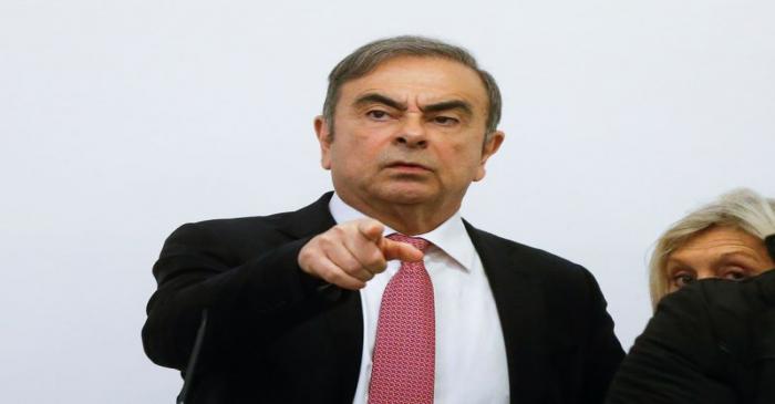 Former Nissan chairman Carlos Ghosn gestures during a news conference at the Lebanese Press