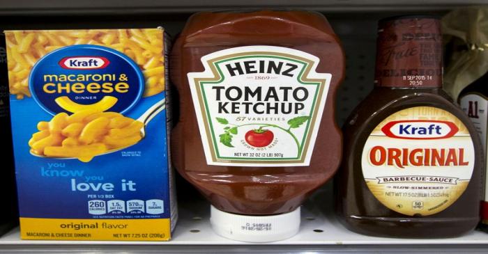 FILE PHOTO: A Heinz Ketchup bottle sits between a box of Kraft macaroni and cheese and a bottle