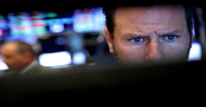 FILE PHOTO: FILE PHOTO: Trader looks at screen on the floor during the IPO of Youdao Inc. (DAO)