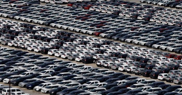 Cars are seen parked at Maruti Suzuki's plant at Manesar