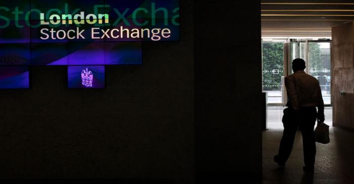 A man walks through the lobby of the London Stock Exchange