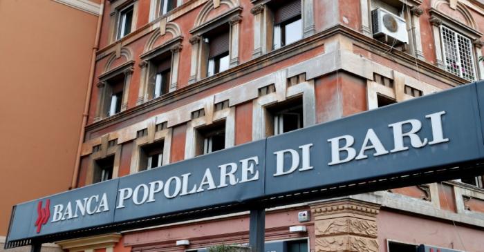 FILE PHOTO: The logo of Banca Popolare di Bari bank is pictured outside the company's branch