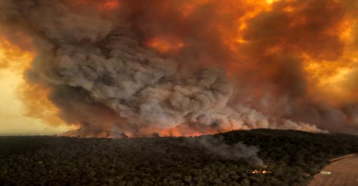 Smoke billows during bushfires in Bairnsdale