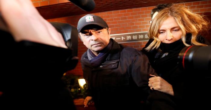 Former Nissan Motor Chairman Carlos Ghosn accompanied by his wife Carole Ghosn, arrives at his