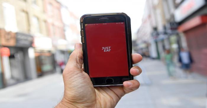 FILE PHOTO: The app for Just Eat is displayed on a smartphone, in London