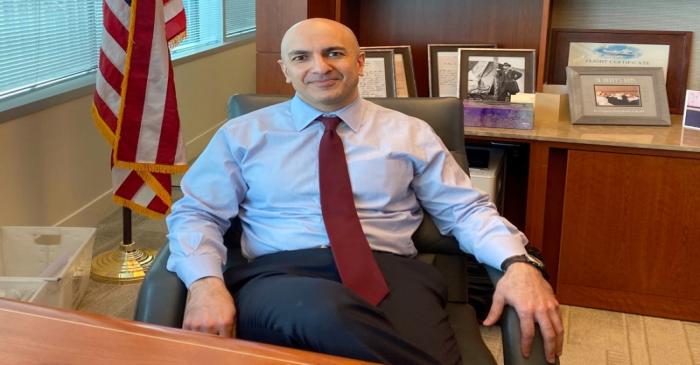 Minneapolis Federal Reserve Bank President Neel Kashkari poses during an interview with Reuters