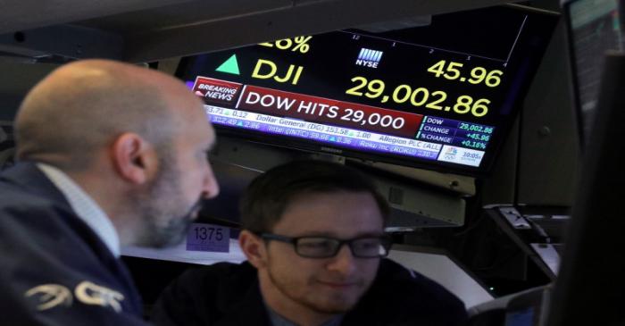 Traders work on the floor at the NYSE in New York