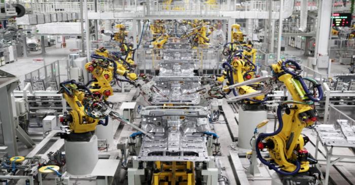 Robotic arms are seen on a vehicle production line at a production base of Great Wall Motors in