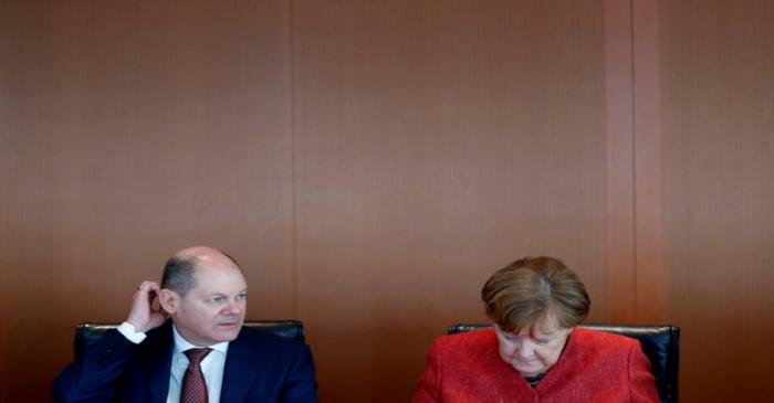FILE PHOTO: German Chancellor Angela Merkel and Finance Minister Olaf Scholz attend the weekly