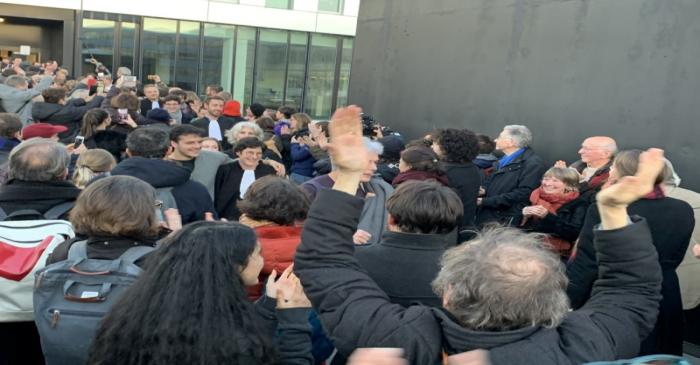 Supporters of twelve activists celebrate after the non guilty verdict of the District Court of