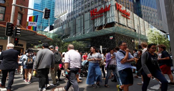 FILE PHOTO: Pedestrians walk past a Westfield shopping mall in Sydney