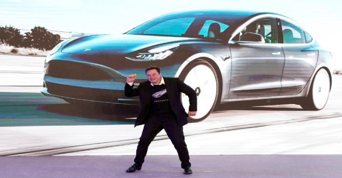 FILE PHOTO: Tesla Inc CEO Elon Musk dances onstage during a delivery event for Tesla China-made