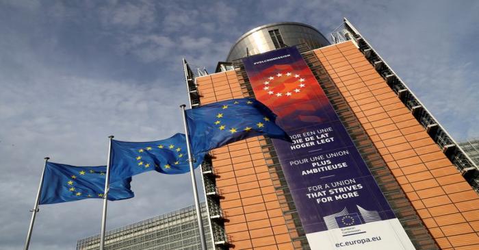 European Union flags fly outside the European Commission headquarters in Brussels