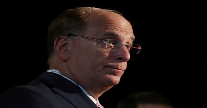 FILE PHOTO: Larry Fink, Chief Executive Officer of BlackRock, stands at the Bloomberg Global
