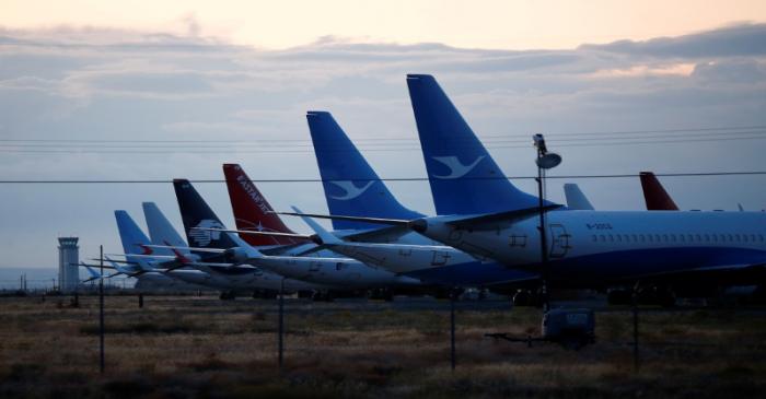 FILE PHOTO: The tails of Boeing 737 MAX aircraft are seen parked at Boeing facilities at the